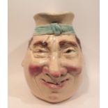 SERRAGUEMES, A LARGE EARLY 20TH CENTURY MAJOLICA POTTERY CHARACTER JUG The country gentleman with