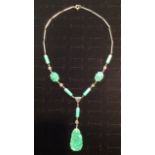 A VINTAGE JADE COLOURED PEKING GLASS AND CUT CRYSTAL NECKLACE The central pendant with floral,