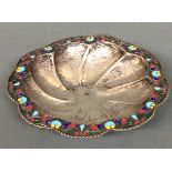 AN ANTIQUE SILVER AND ENAMEL DECORATED SHALLOW BOWL The central recess with a hammered finish and