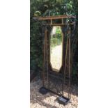 IN THE MANNER OF EDGAR BRANDT, 1880 - 1960, A WROUGHT IRON HALL STAND With a mirrored back,