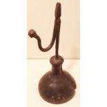 AN 18TH/19TH CENTURY IRON TABLE RUSHLIGHT With scroll arm and faceted ball terminal, raised on a