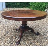 AN EARLY VICTORIAN ROSEWOOD BREAKFAST TABLE The circular top supported on a tapering column,