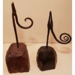 AN 18TH CENTURY IRON TABLE RUSHLIGHT HOLDER With spiral form arm, raised on a woodblock base with