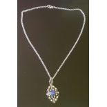A VICTORIAN STYLE SAPPHIRE AND DIAMOND PENDANT The cushion cut sapphire claw set in 18ct gold, to