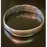 AN 18TH/19TH CENTURY SILVER LOOP RING The thin flat section band, inscribed to inner face in