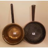 TWO 17TH/18TH CENTURY BRASS AND COPPER COOKING PANS Deep circular, having a cast iron handle and