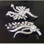 A PAIR OF MID 20TH CENTURY PLATINUM AND DIAMOND SPRAY BROOCHES Both brooches of differing foliate/