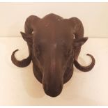 A 20TH CENTURY WALL MOUNTING BRONZE RAMS HEAD. (20cm x 24cm x 16cm)