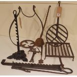 A MIXED LOT OF ANTIQUE IRON ITEMS To include a chimney crane, pothook, rush holder, saw tooth stand,