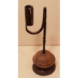 AN 18TH CENTURY IRON TABLE RUSHLIGHT HOLDER AND CANDLE SOCKET The item with partial twist and 'U'
