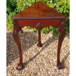 A MID 18TH CENTURY MAHOGANY TRIANGULAR CORNER TABLE The shaped apron centred with a shell, raised on