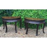 A PAIR OF 19TH CENTURY CHINESE HALF MOON CENTRE TABLES With double carved borders, each raised on