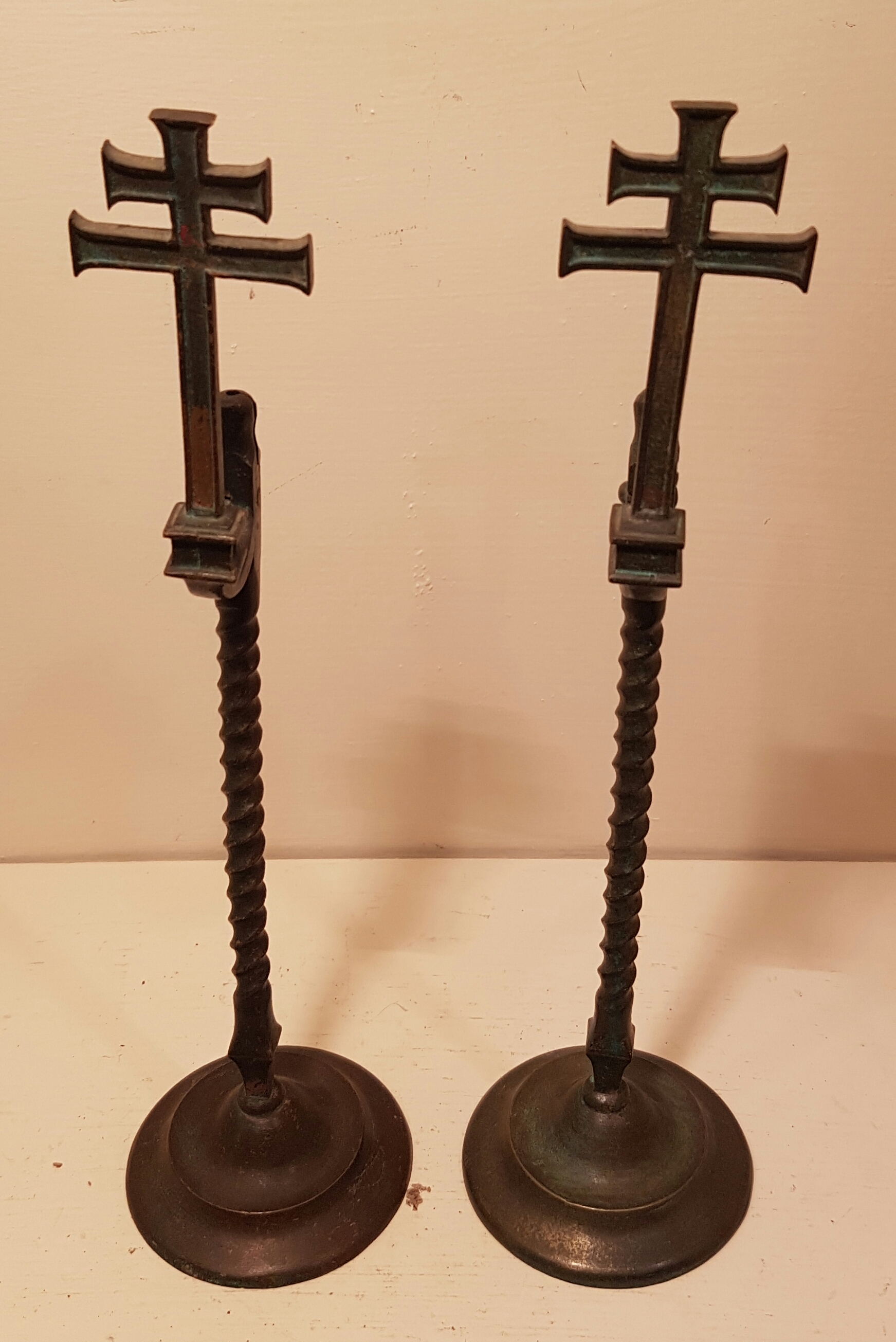 A PAIR OF 19TH CENTURY CONTINENTAL COPPER ECCLESIASTICAL RUSHLIGHT HOLDERS On circular bases, with