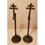 A PAIR OF 19TH CENTURY CONTINENTAL COPPER ECCLESIASTICAL RUSHLIGHT HOLDERS On circular bases, with