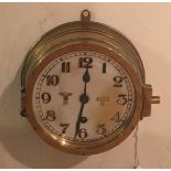 TIRPITZ CLOCK, WORLD WAR II GERMAN BATTLESHIP, A BRASS CASED SHIPS CLOCK The silvered dial