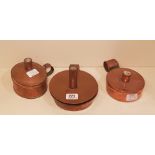 THREE ANTIQUE COPPER CANISTER TINDER BOXES With dampers, steel and flint, two circular and one oval.