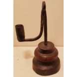 AN 18TH CENTURY IRON TABLE RUSHLIGHT HOLDER AND CANDLE SOCKET With circular grip and bracket arm,