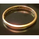 A VICTORIAN HALLMARKED 22CT GOLD WEDDING BAND The flat section gold band, with a sentimental