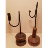 AN 20TH CENTURY IRON TABLE RUSHLIGHT AND CANDLE SOCKET With part spiral stem, set upon a turned