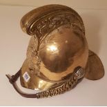 A LATE 19TH CENTURY FRENCH BRASS FIREMAN'S HELMET.