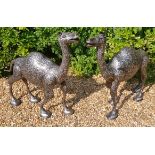 A PAIR OF 20TH CENTURY NIELLO DECORATED STEEL STATUES Of camels. (106cm x 98cm)