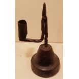 AN 18TH CENTURY IRON RUSHLIGHT AND CANDLE SOCKET With irregular spiral twist stem and arm, raised on