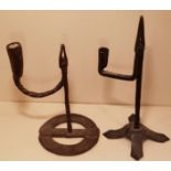 AN 18TH CENTURY IRISH IRON TABLE RUSHLIGHT HOLDER AND CANDLE SOCKET With wide ring base and spiral
