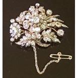 A VICTORIAN PERIOD DIAMOND BROOCH/PENDANT Of floral design, the spray of flowers and leaves is set
