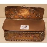 AN 18TH CENTURY SHEET BRASS AND COPPER CANDLE BOX With scroll work decoration, cornered with lion