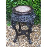 A 19TH CENTURY ORIENTAL JARDINIÈRE With a hexagonal inset top, on a finely carved hardwood stand. (