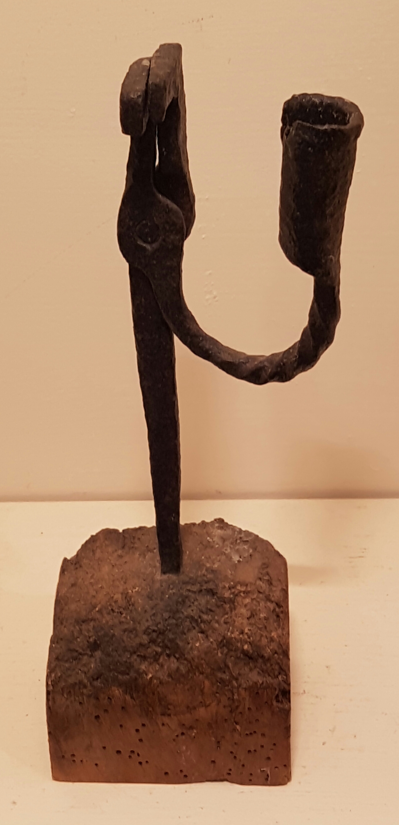 AN 18TH CENTURY IRON TABLE RUSHLIGHT HOLDER AND CANDLE SOCKET On a 'U' form arm, with screw twist