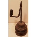 AN 18TH CENTURY IRON TABLE RUSHLIGHT AND CANDLE SOCKET The stem and bracket arm, with spiral twist