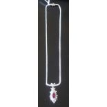 AN 18CT WHITE GOLD, PINK TOURMALINE AND DIAMOND NECKLACE The oval cut pink tourmaline claw set to