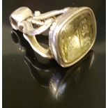 A 19TH CENTURY 9CT GOLD MOUNTED FOB SEAL Scrolling stirrup form seal, with foiled citrine seal