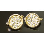 A PAIR OF HIGH CARAT GOLD AND DIAMOND CLUSTER CLIP EARRINGS The flat circular gold plaques pavé set,