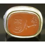 A 19TH CENTURY 14CT GOLD MOUNTED FOB SEAL Gold hatch stirrup form seal, with Cornelian seal matrix