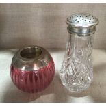 A CONTINENTAL CUT CRYSTAL SILVER TOPPED SUGAR SHAKER Along with a modern cranberry glass silver