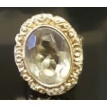 A HALLMARKED VICTORIAN STYLE 9CT GOLD AND CITRINE DRESS RING The large oval cut pale gold citrine