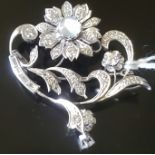 A 14CT WHITE GOLD, MOONSTONE AND DIAMOND FLORAL DESIGN BROOCH Designed as a single flowerhead over a