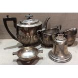 WALKER & HALL, AN EARLY 20TH CENTURY THREE PIECE SILVER TEA SERVICE With a fluted base, with ebony