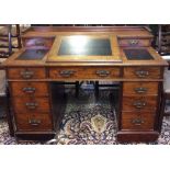 A VICTORIAN MAHOGANY DICKENS DESK