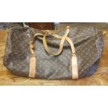LOUIS VUITTON, A VINTAGE LOUIS VUITTON LOGO DESIGN CANVAS AND LEATHER HOLDALL Interior and