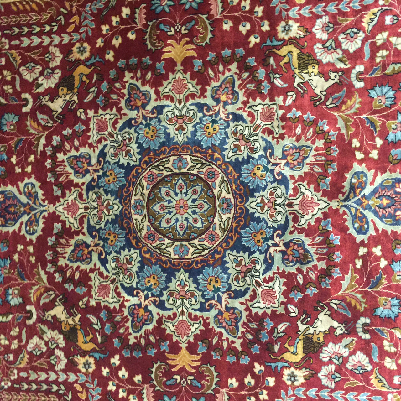 A PERSIAN RUG With central madder field and numerous script, contained within running borders. ( - Image 5 of 5