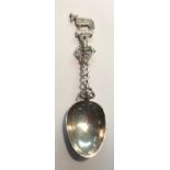 A LARGE EARLY CONTINENTAL SILVER SPOON Having an intertwined column, mounted with dolphins and