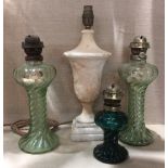 A COLLECTION OF LATE 19TH/EARLY 20TH CENTURY GLASS OIL LAMPS To include a pair moulded with a spiral