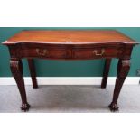 A 19TH CENTURY SERVING TABLE The serpentine front with two drawers, raised on acanthus carved