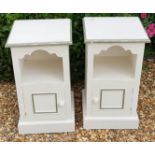 A PAIR OF PAINTED PINE BEDSIDE CABINETS With open shelves above cupboards, with a serpentine shape