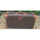 MULBERRY, A BROWN LEATHER SUITCASE With chrome hinges and locks. (72cm x 41cm x 20cm)