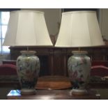 A PAIR OF CHINESE TABLE LAMPS AND SHADES Decorated with flowers. (75cm including shades)