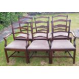 A SET OF SIX LADDER BACK DINING CHAIRS To include two carvers and four chairs, scrolled top rails